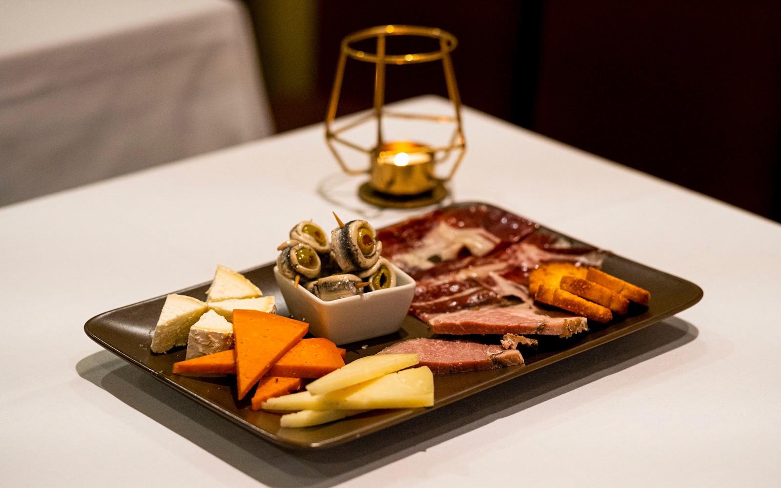 Spanish tapas platter with cheese, meats and olives served at a Pure Flamenco Show.