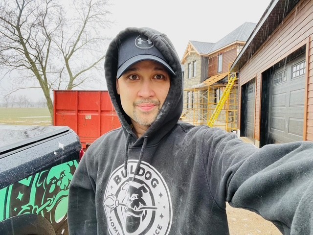 man standing infront of miter saw