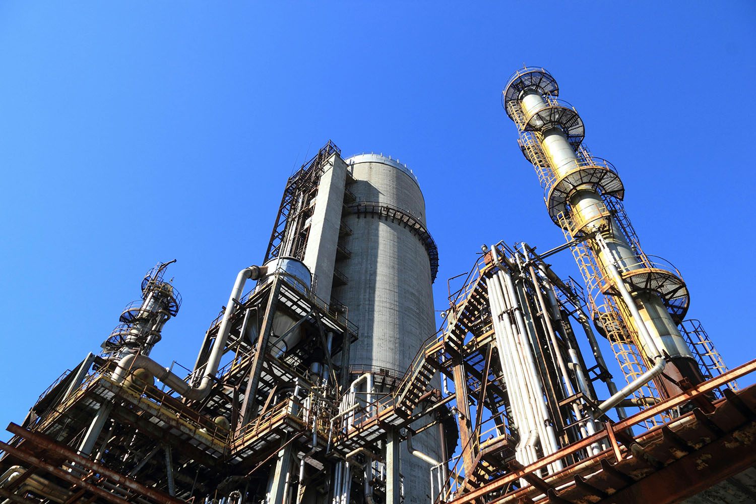 Large industrial plant with processing towers and mechanical infrastructure