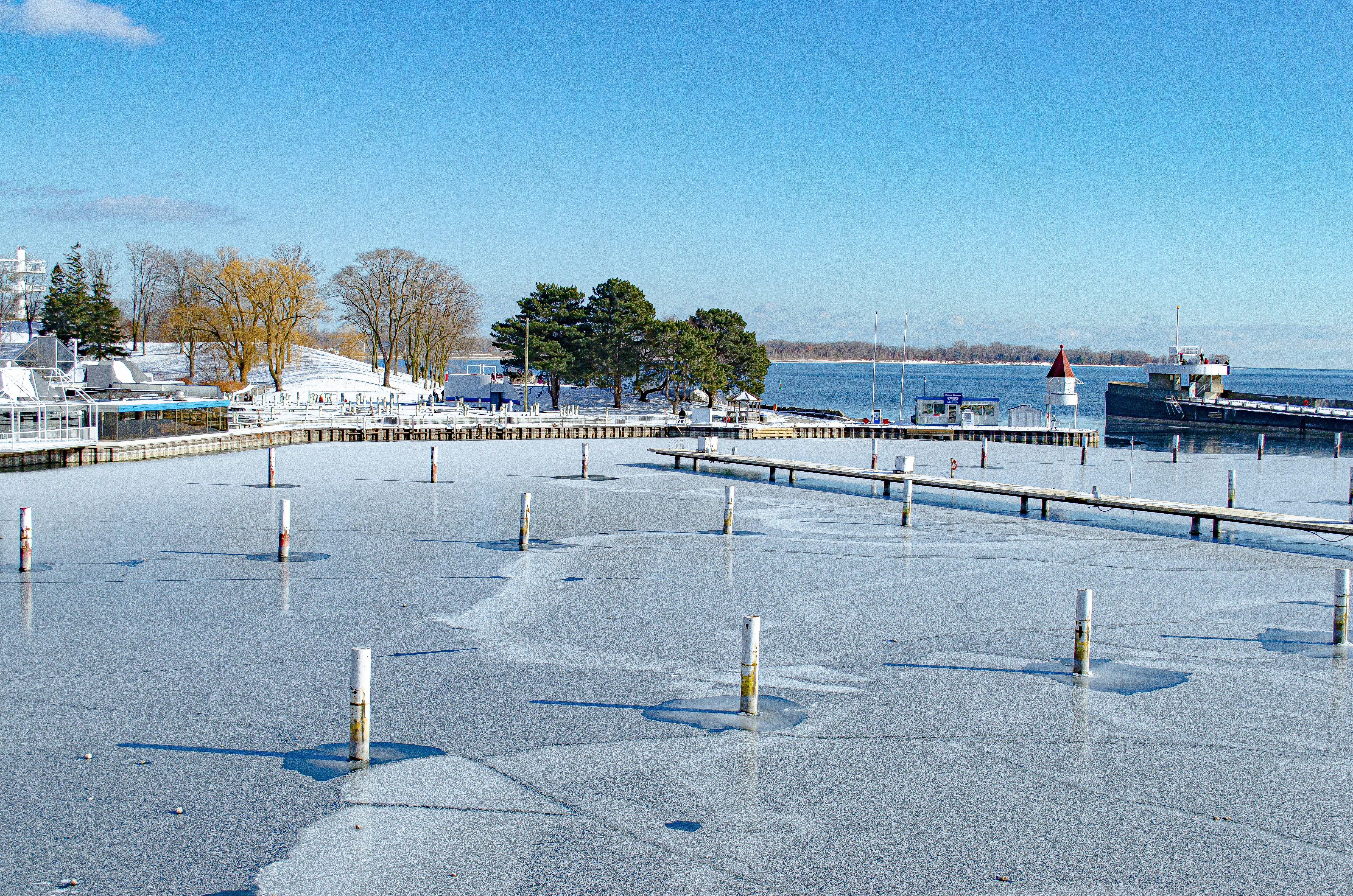 white and red building near body of water during daytime