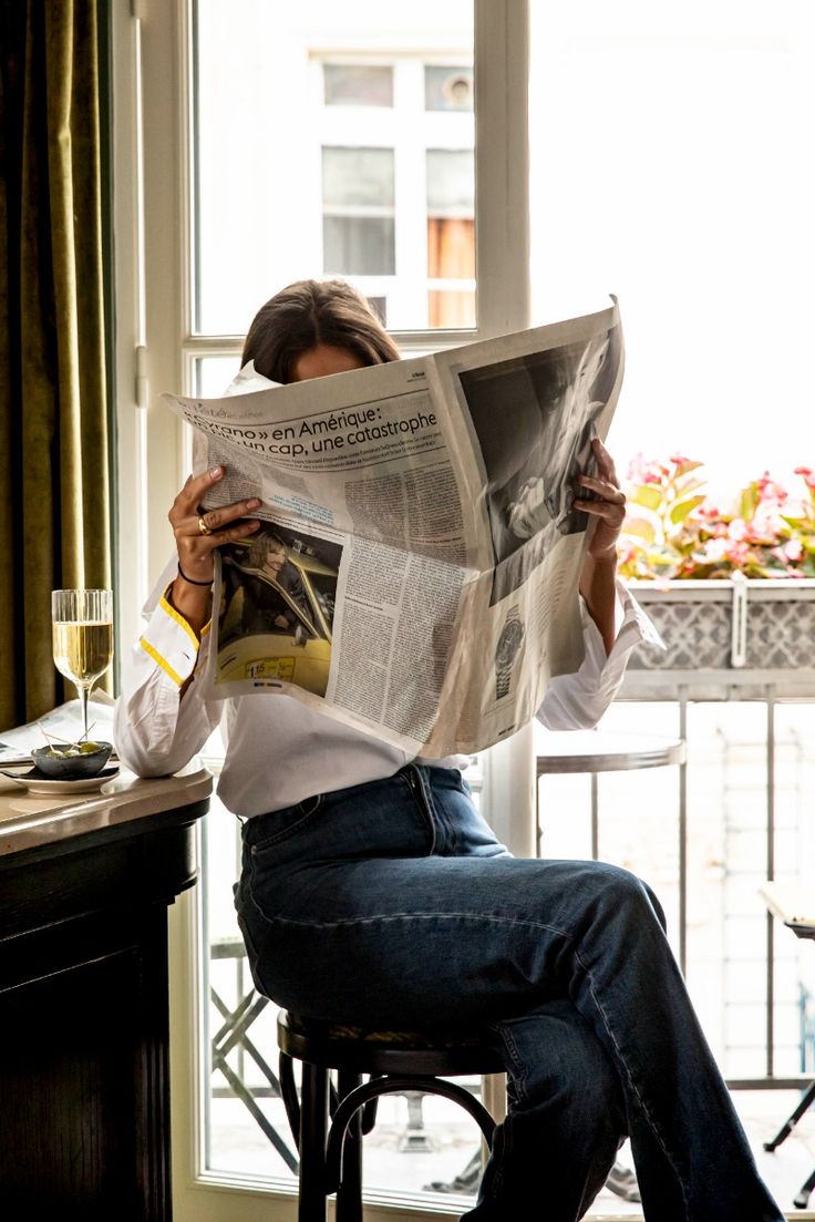 Portrait of a man with short dark hair and a trimmed beard, dressed in a dark shirt, on a simple background.