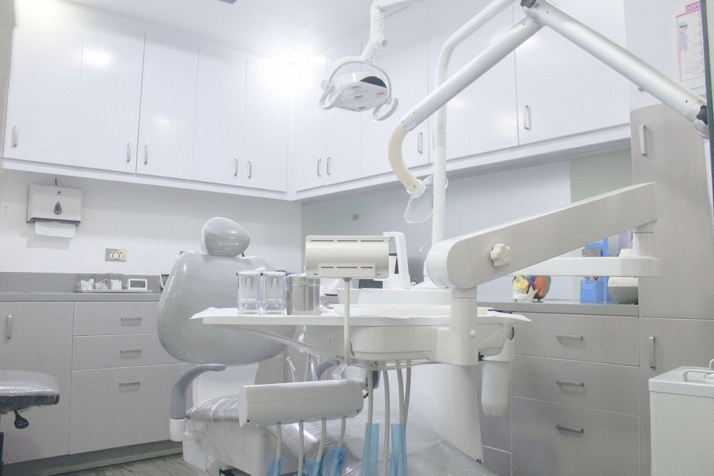 Modern dental clinic treatment room interior at K DentArtistry Makati featuring advanced dental chair, lighting, and professional dental equipment.