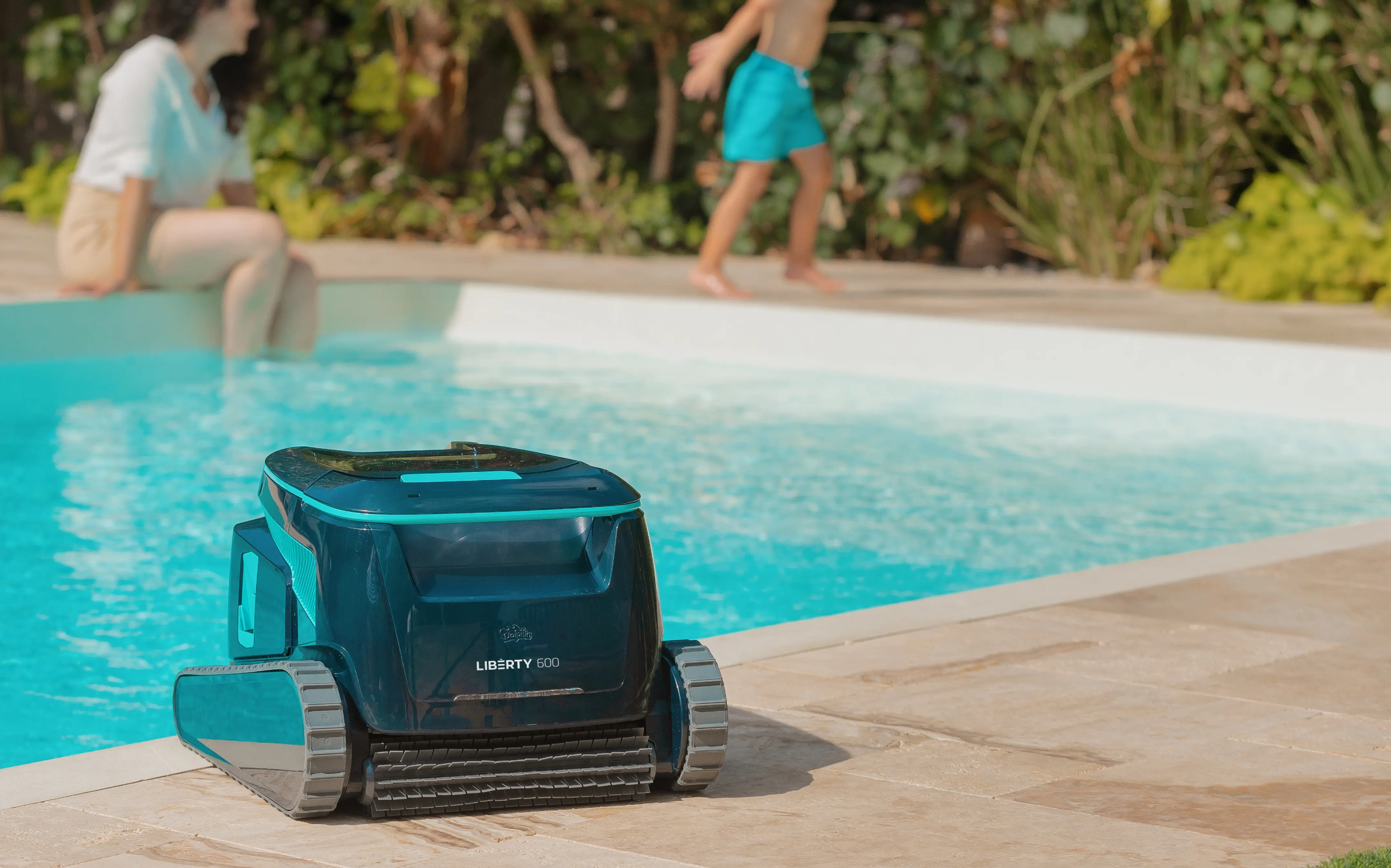 A picture of the MAytronics Liberty 400 cleaner next to a pool on a summers day