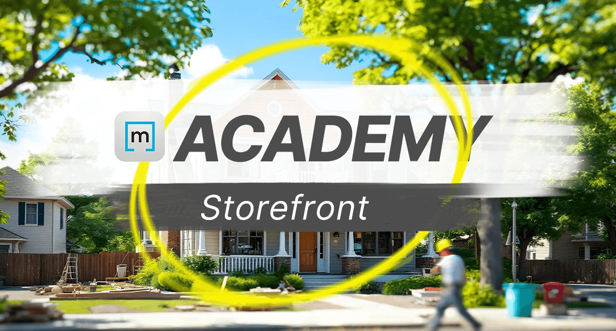 a restorer working with his tablet in front of a house