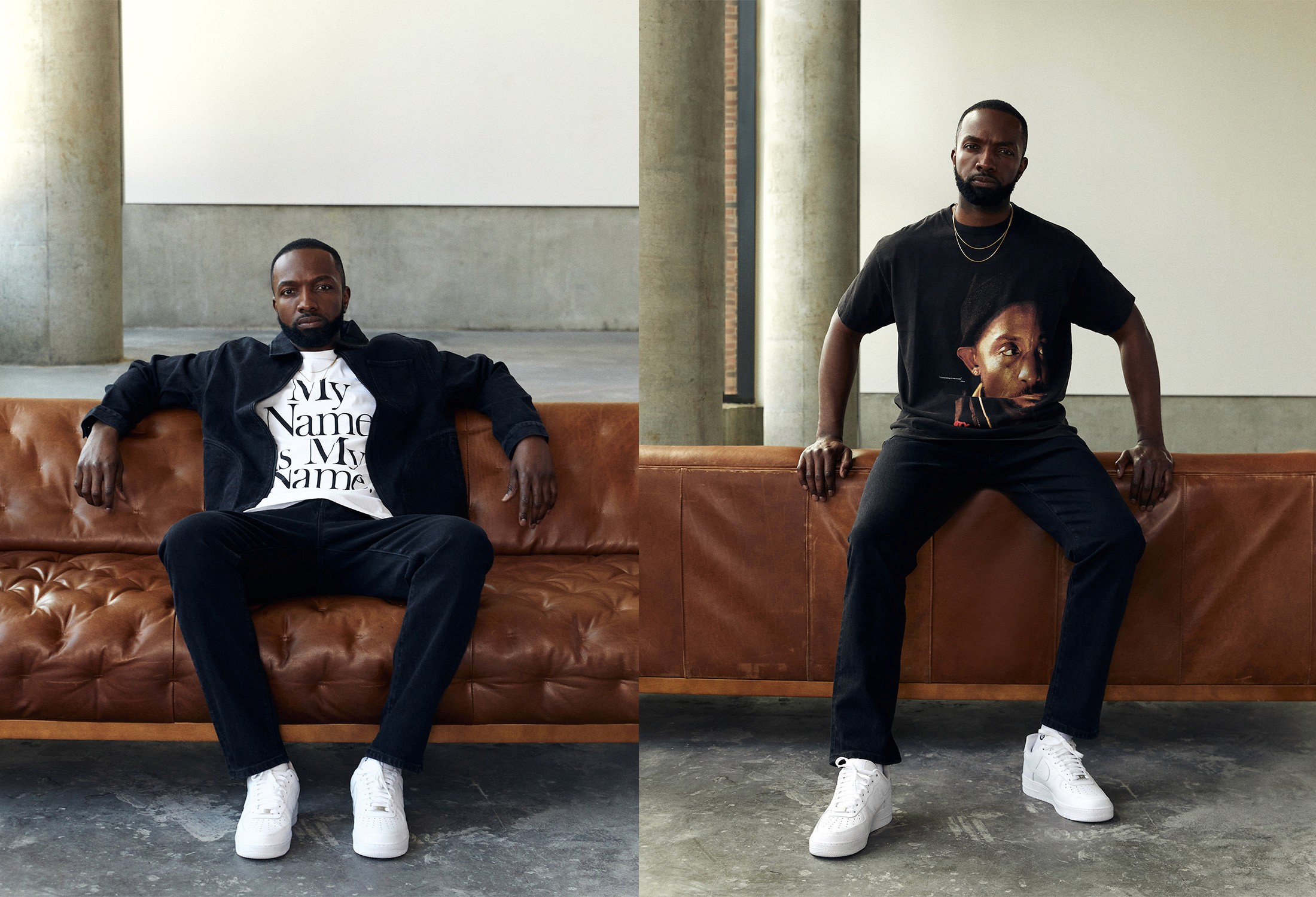 Man in graphic T-shirts and dark layers poses on a leather sofa in a minimal fashion editorial interior.