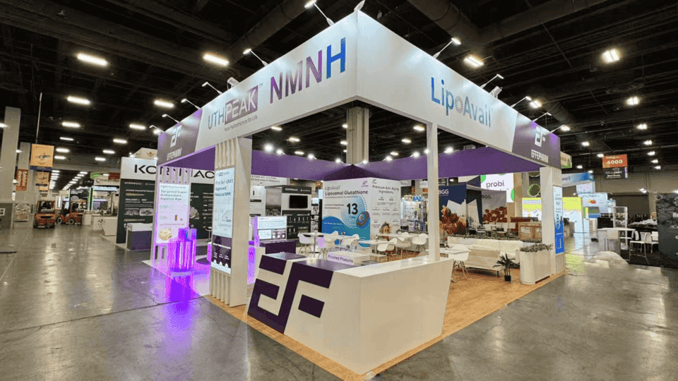 20x20 food and beverage booth with sampling station, product displays, graphics, storage, and open layout