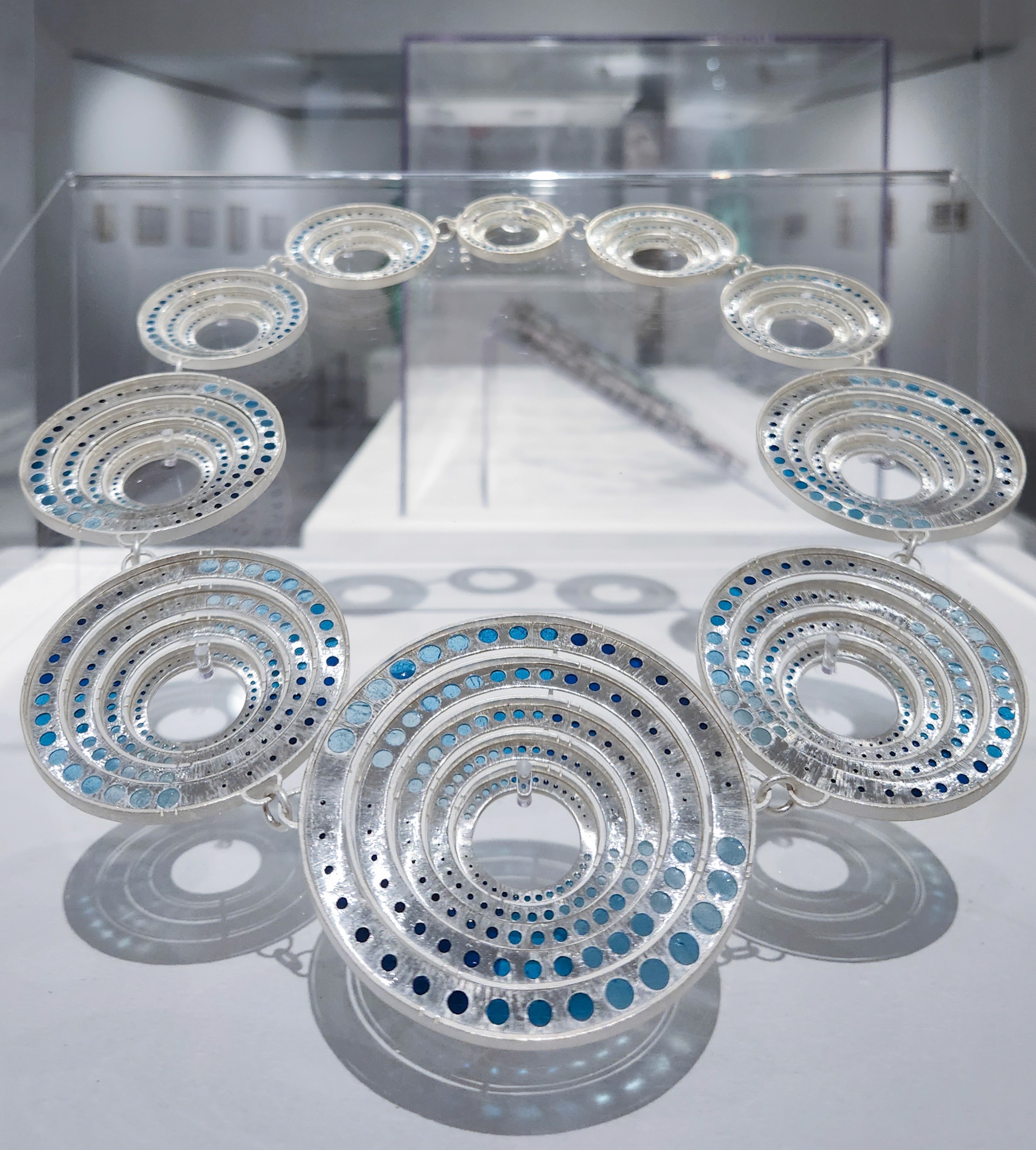 Ripple by Yuxin Song, plique-à-jour enamel on silver. Contemporary jewelry art, 26 x 30 x 3cm, 2025. Masterpiece of translucent enameling technique.