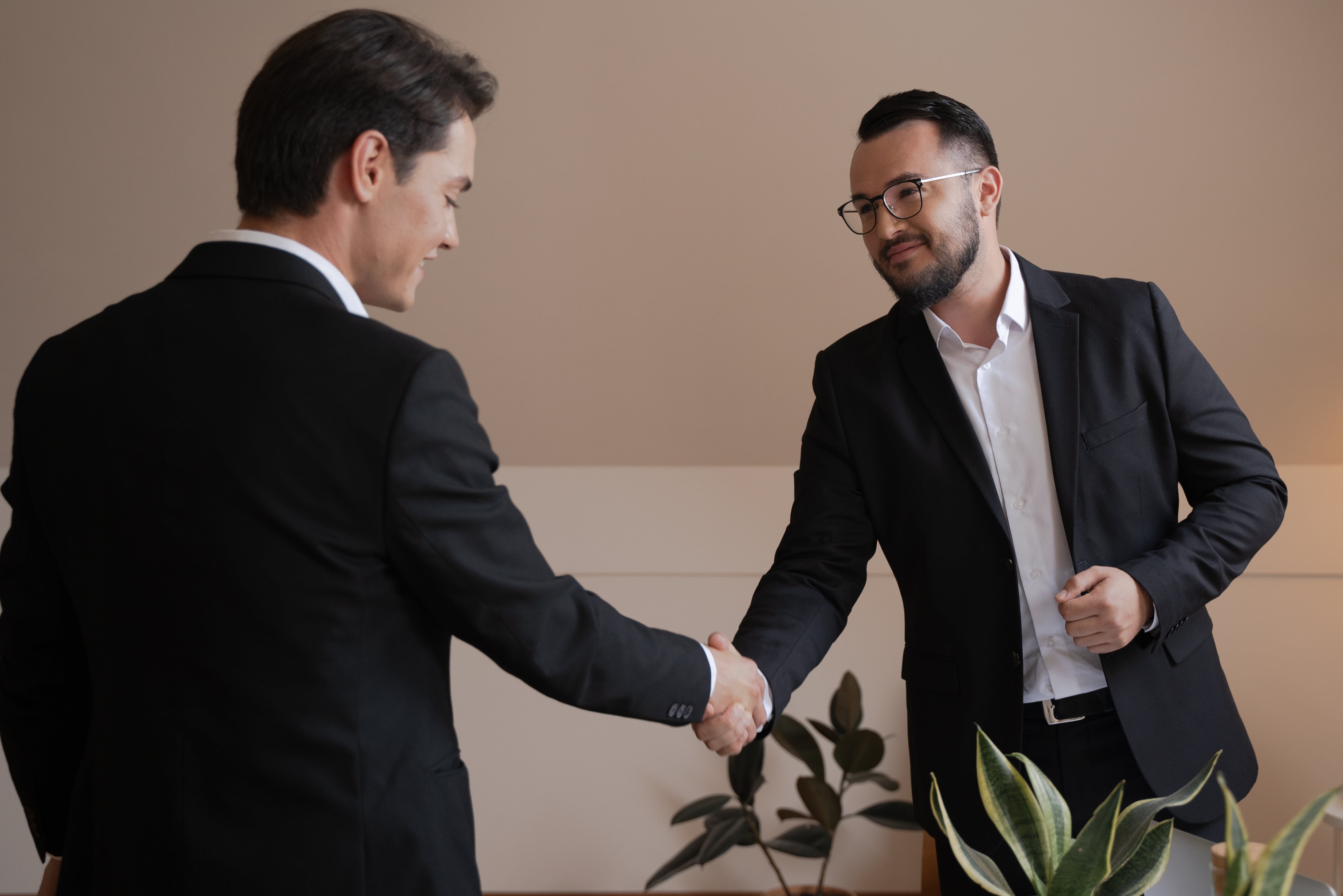 Broker and client shaking hands