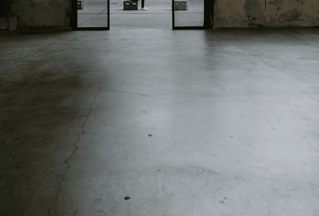 person in white shirt walking on sidewalk during daytime