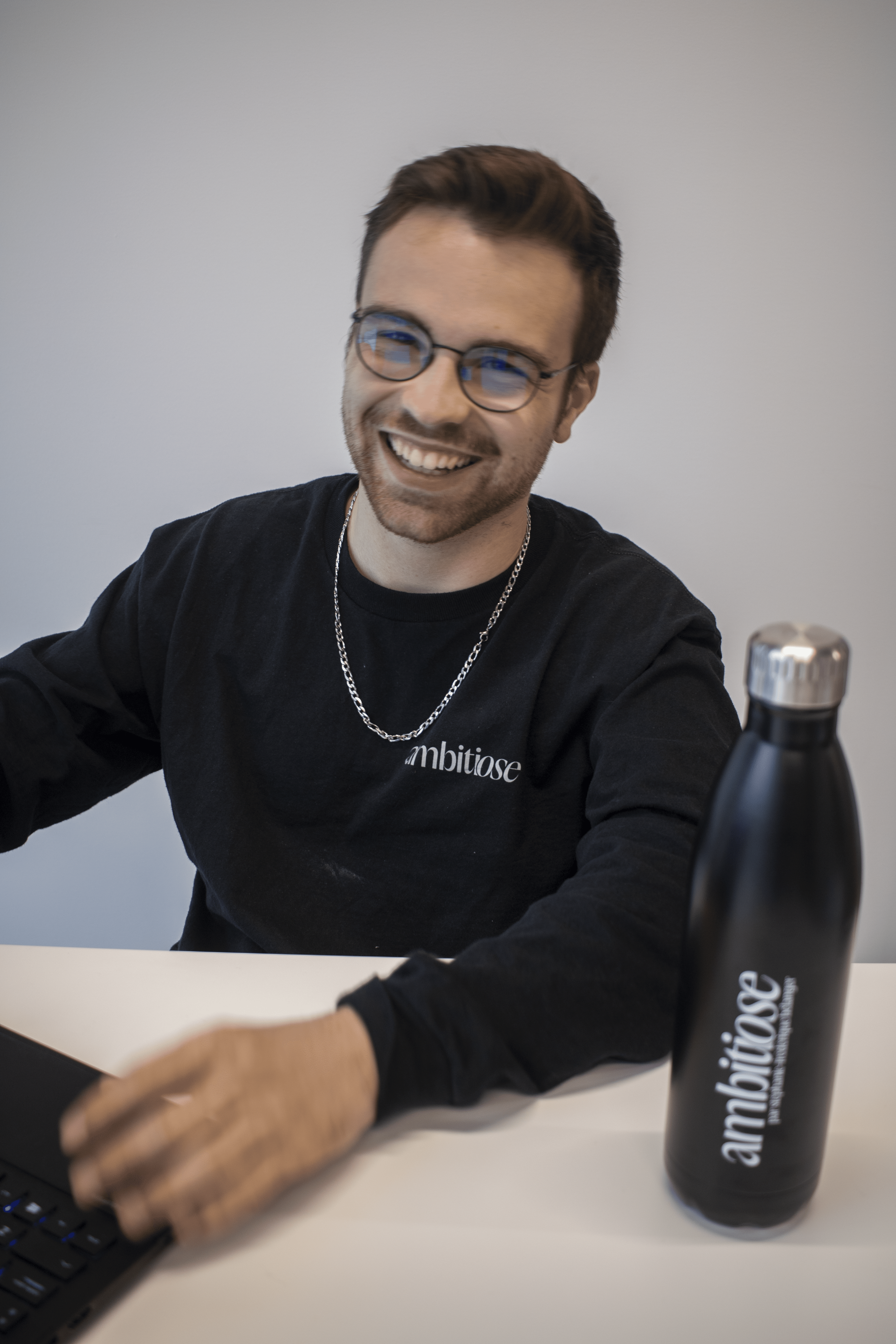 A men smiling in the office