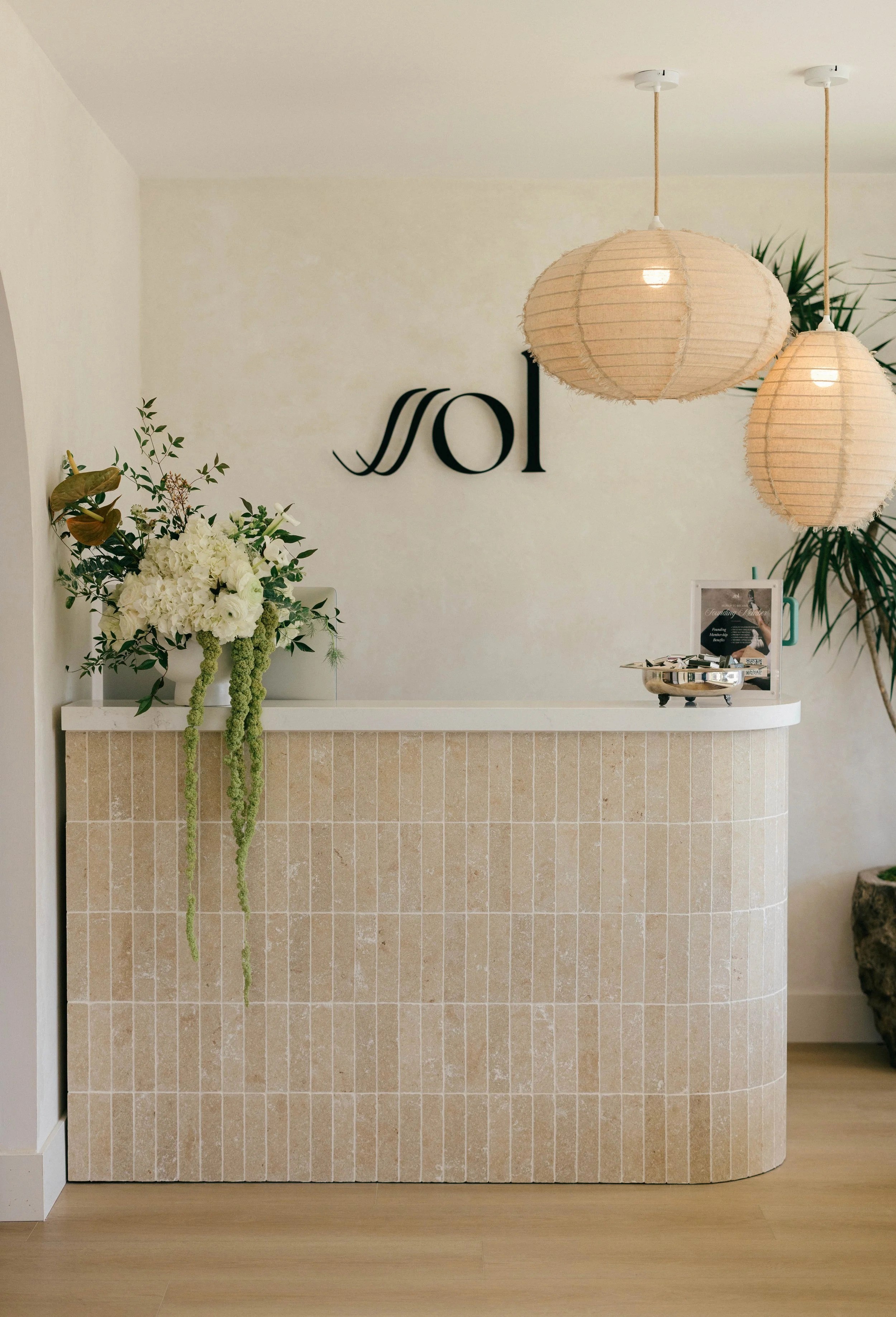 Custom Ssol Pilates reception signage installed at the studio entrance, reinforcing brand identity and consistency