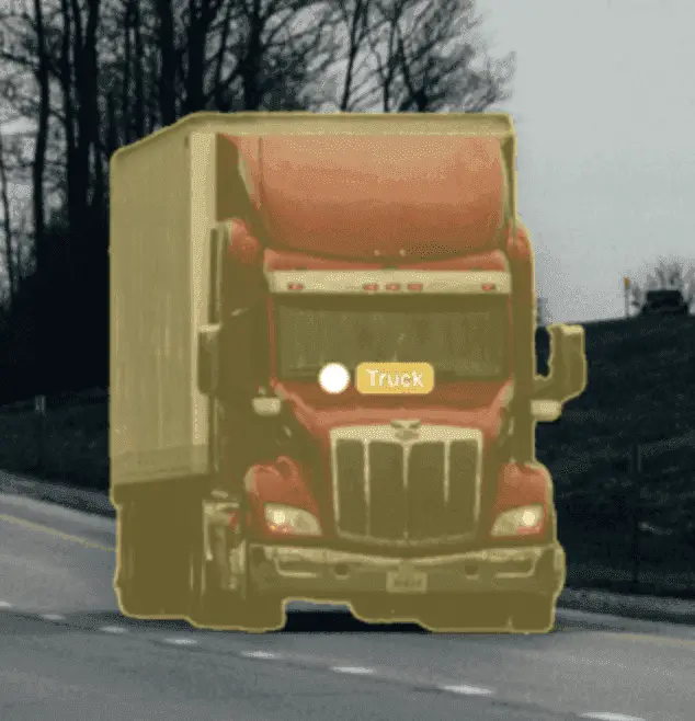 Truck with yellow bounding box overlay