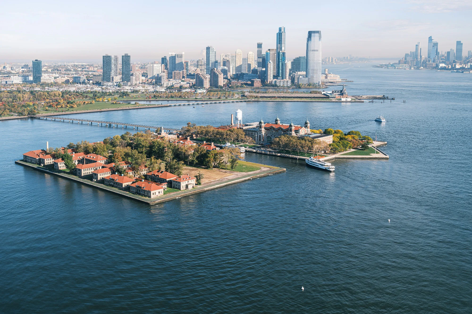 Aerial view of Ellis Island with the New York City skyline in the background