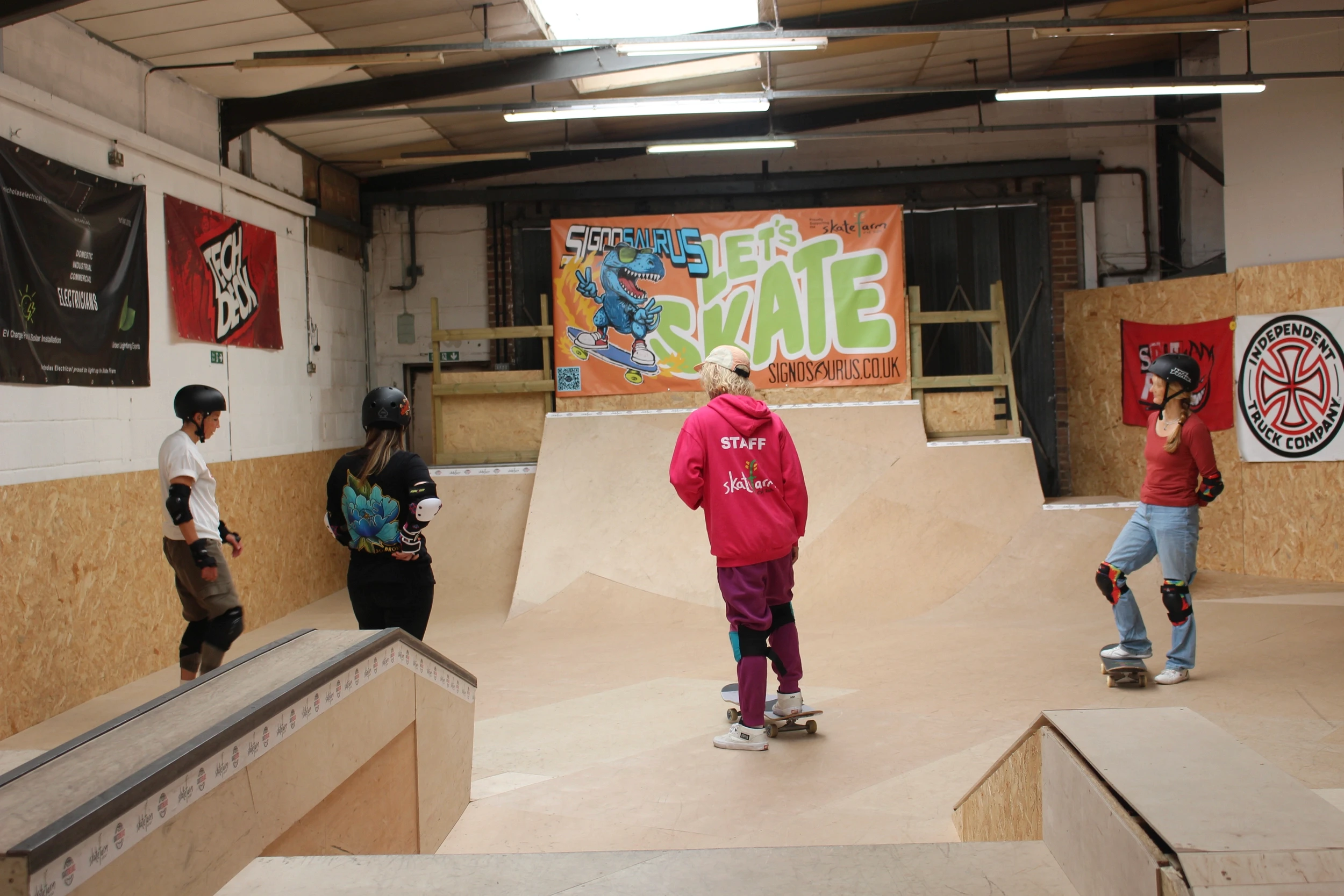 Girls skating at The Skate Farm indoor skatepark in Haywards Heath during a Sunday girls-only session