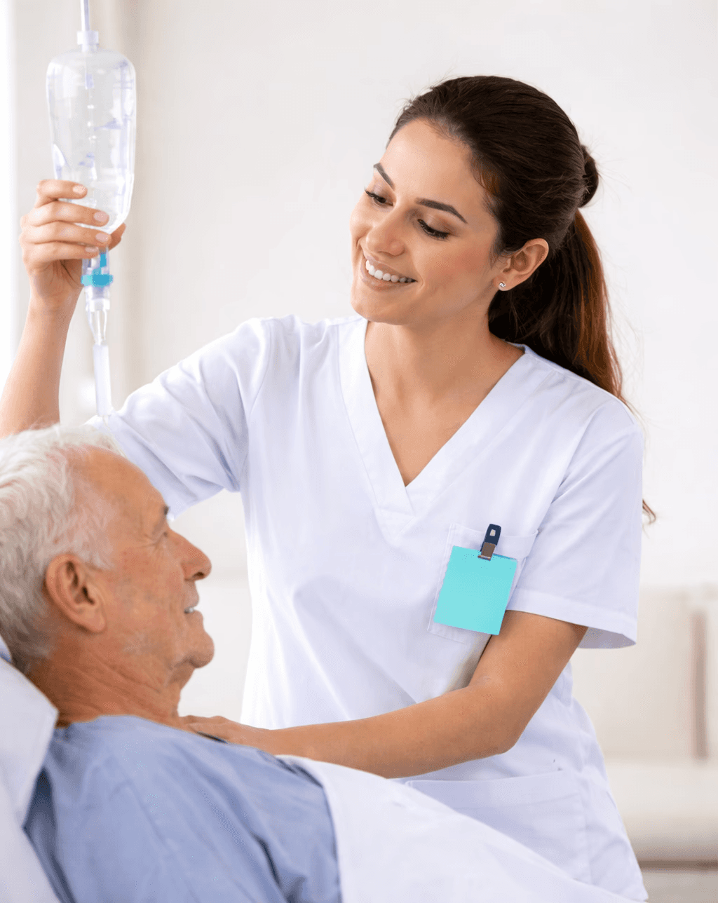 Aerial view of a winding road cutting through rocky terrain with patches of grass.