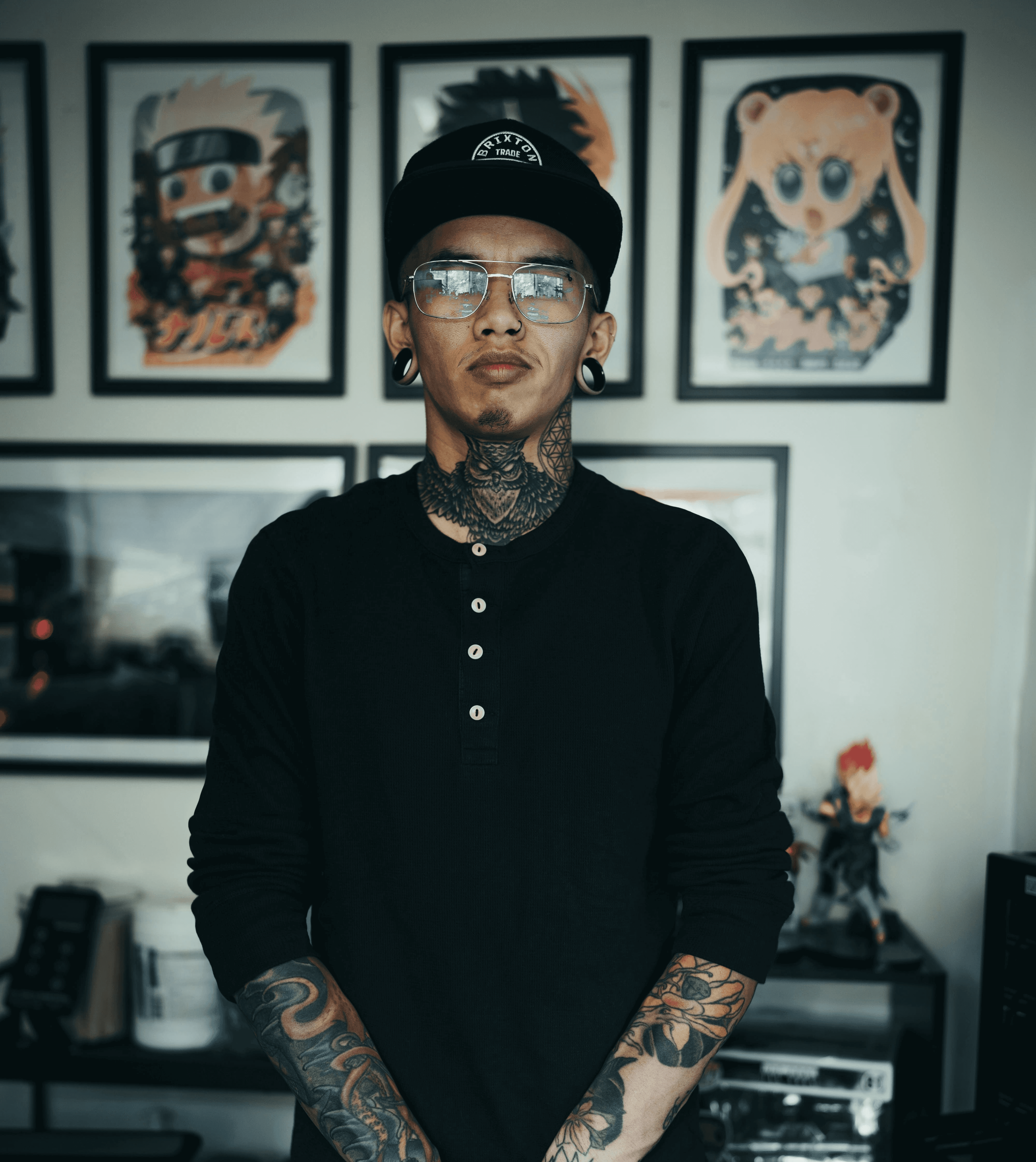 man in black long sleeve shirt with black and red floral tattoo on arm