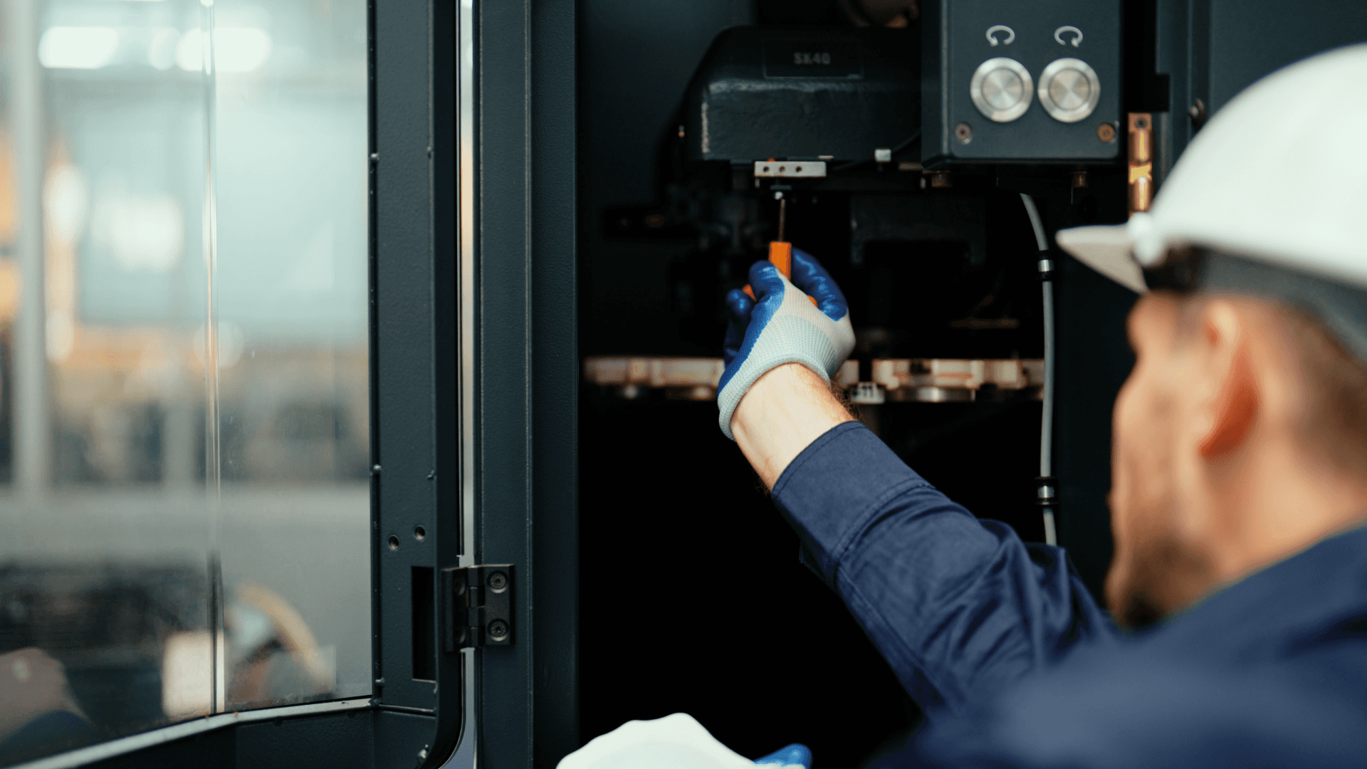 Facilities management engineer carrying out planned maintenance checks as part of FM mobilisation and asset verification