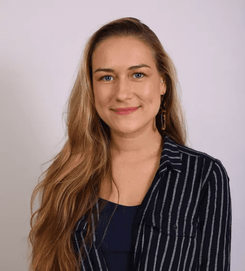 man wearing green crew-neck top and eyeglasses with black frames looking at side