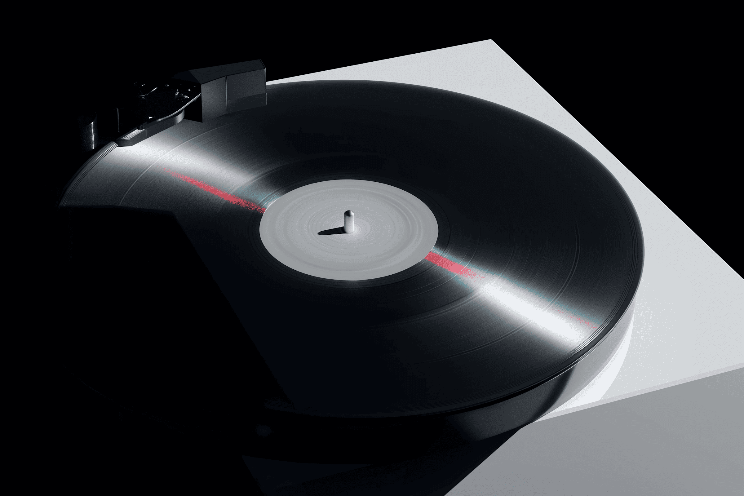 Vinyl record turntable in a dark room with soft lighting