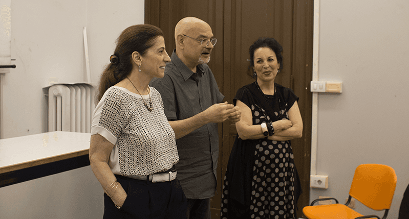 two women and man in the middle
