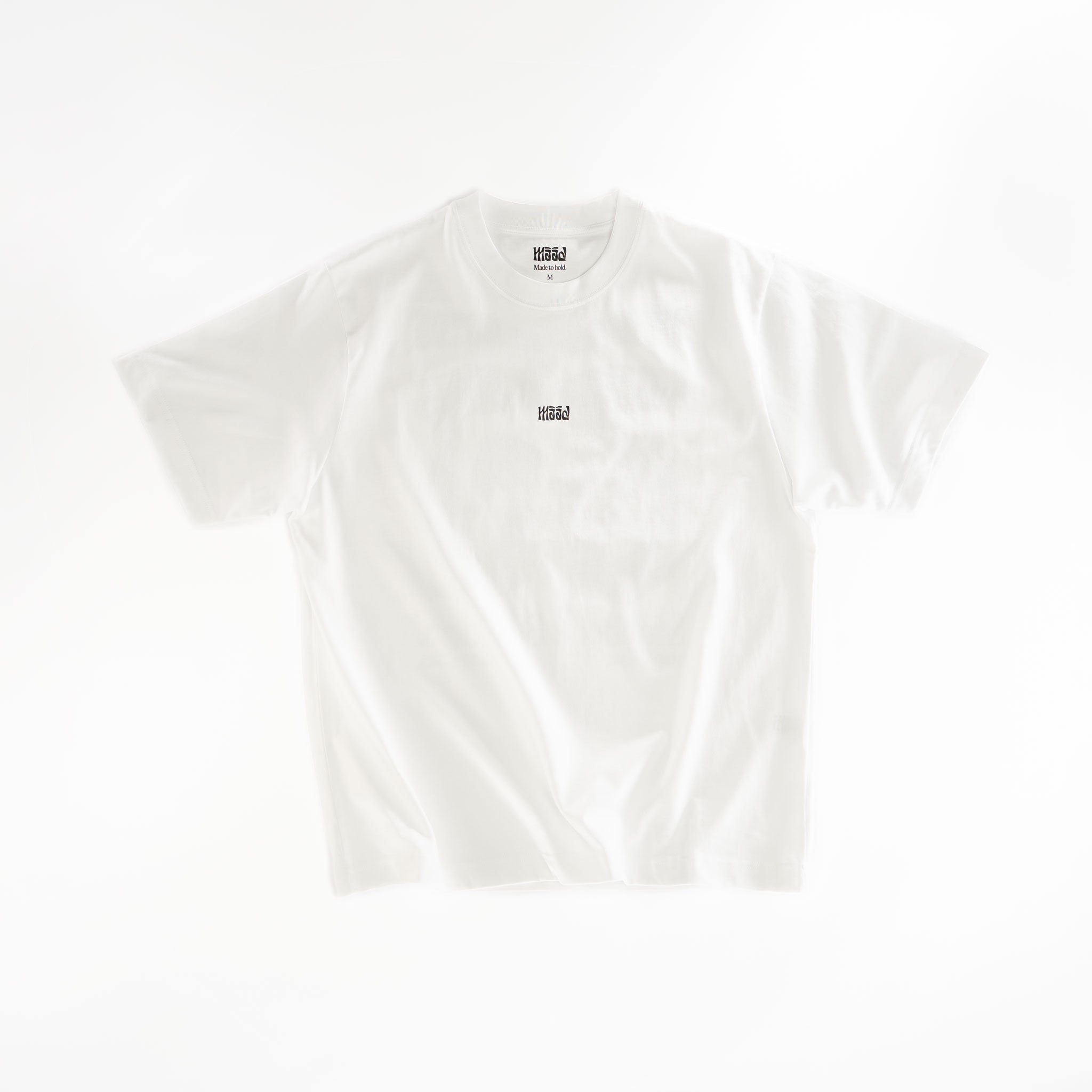 White t-shirt with a small logo on a white background