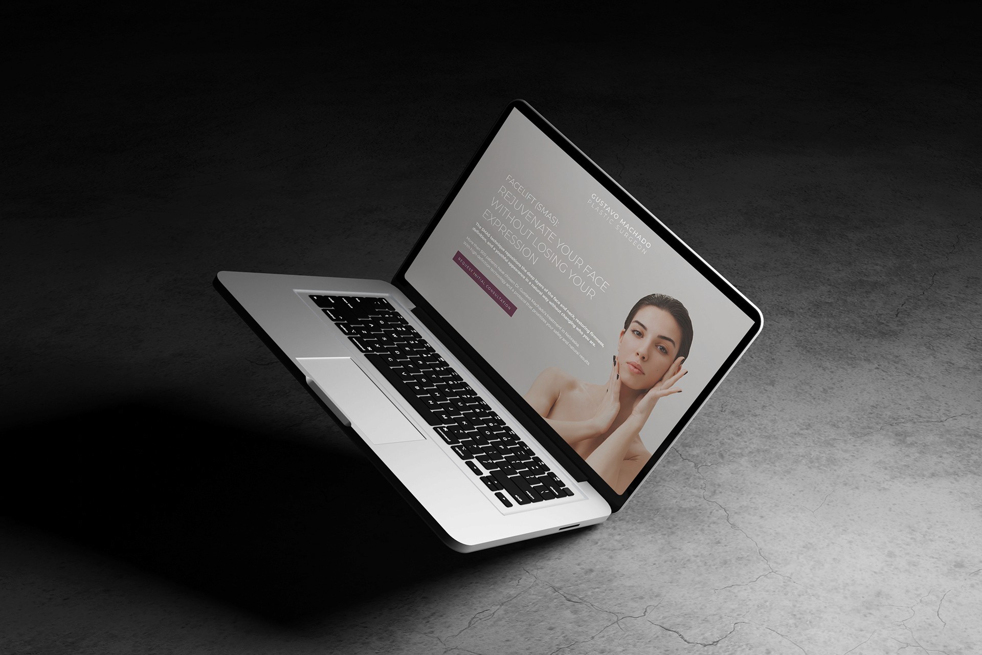 two ladies looking at a laptop and smiling