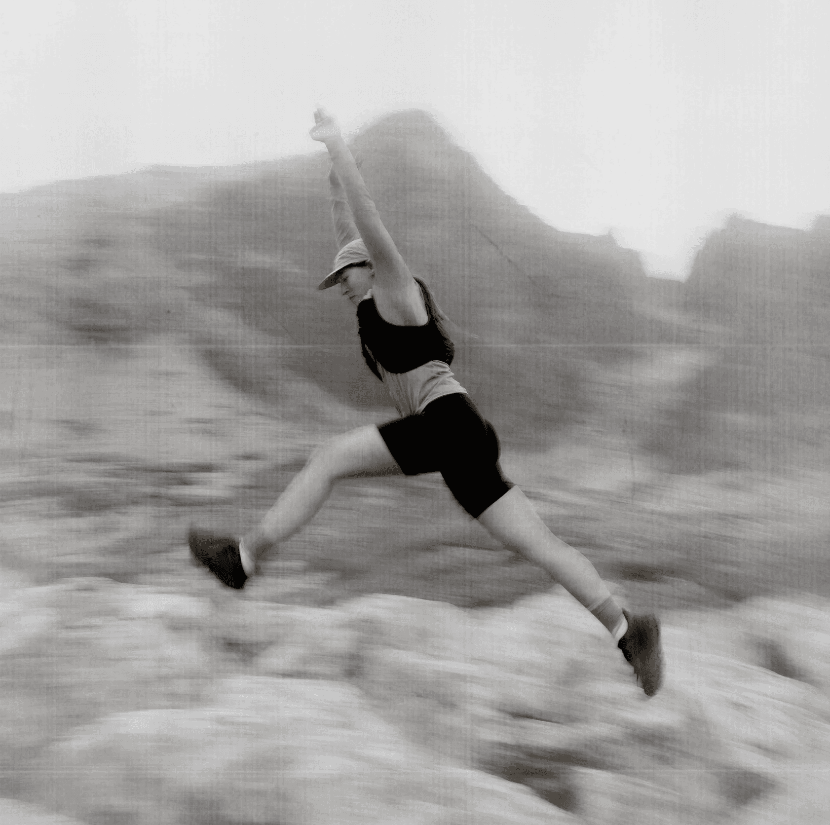 abstract picture of a woman jumping and stuck mid air.