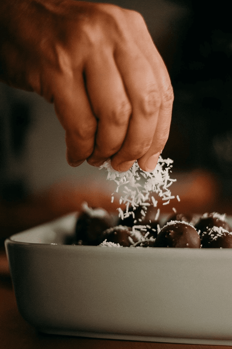 A clean, sharp, high dynamic range close-up profile photograph of a leopard walking through tall green grass. Shot on Sony A7IV.