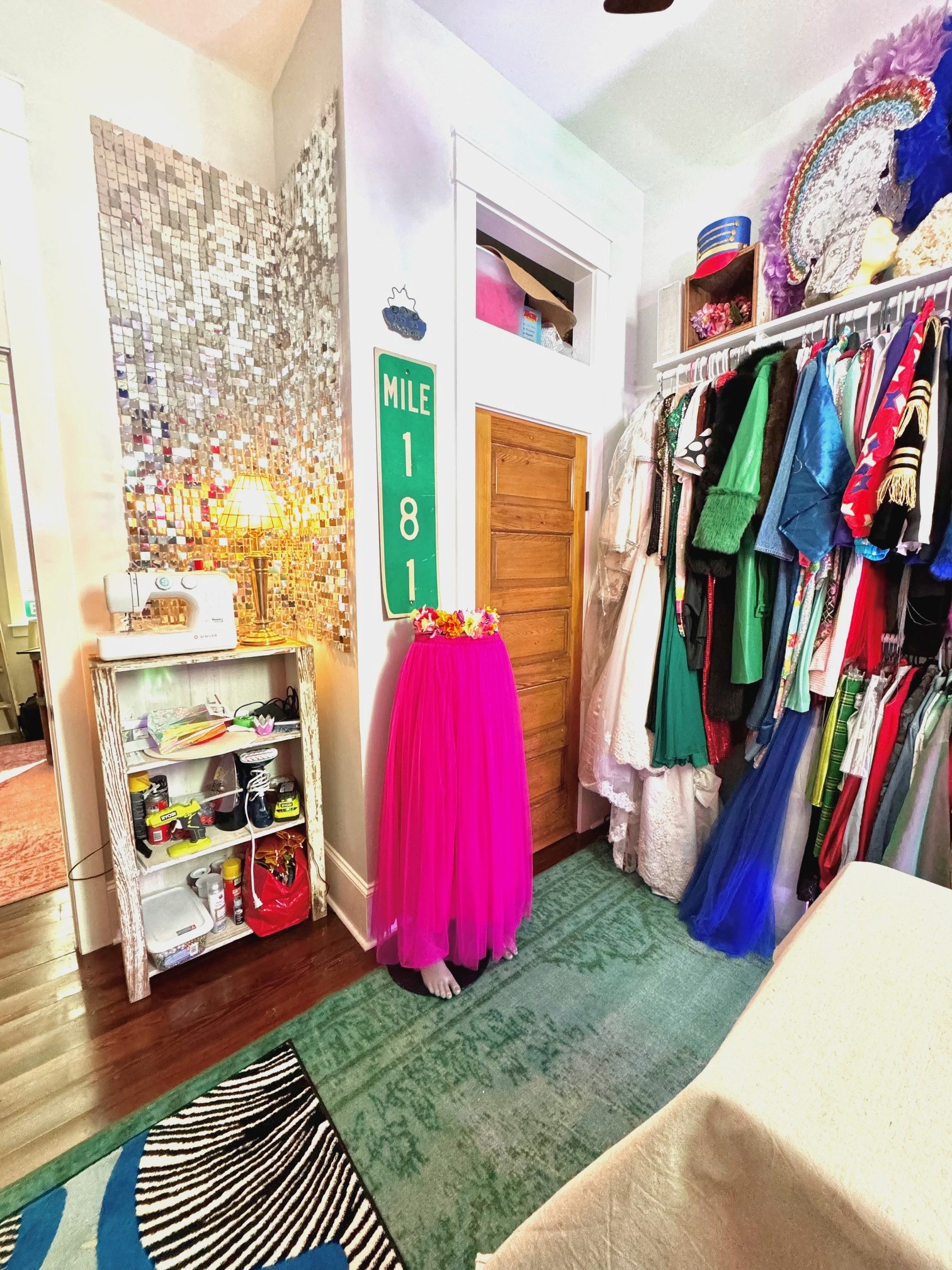 colorful costume room with lots of rugs and costumes and headpieces