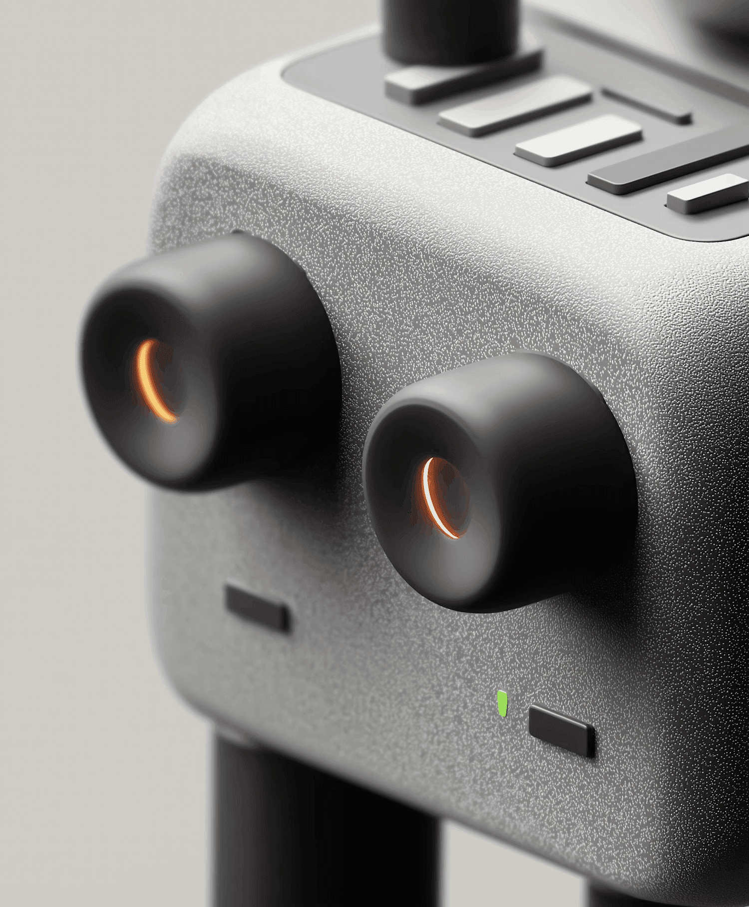 Textured gray device with two prominent glowing orange lenses.