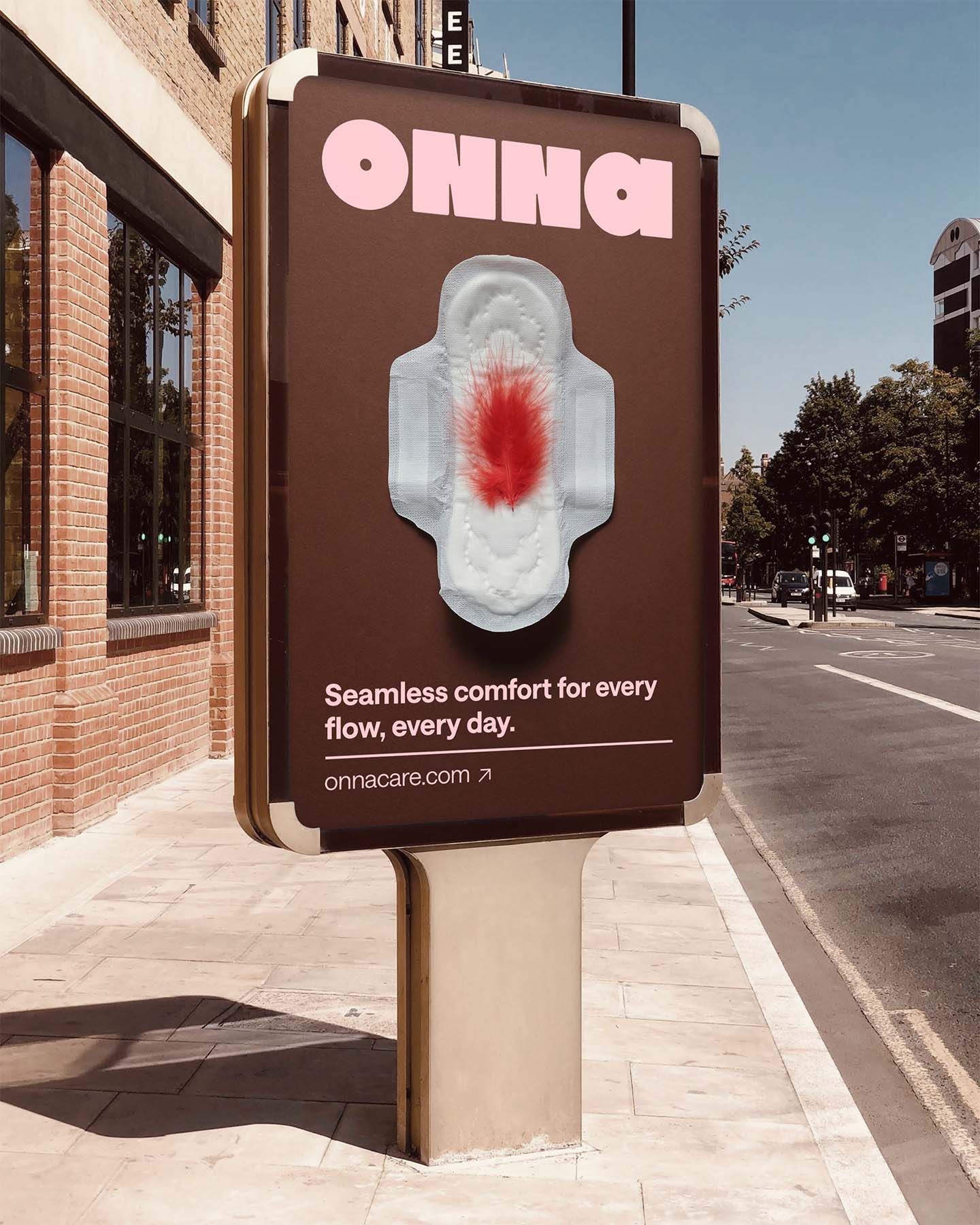 Street advertising display with Onna branding showing period product with red feather visual