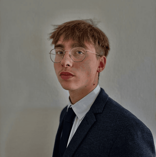 a woman with an afro is looking at the camera
