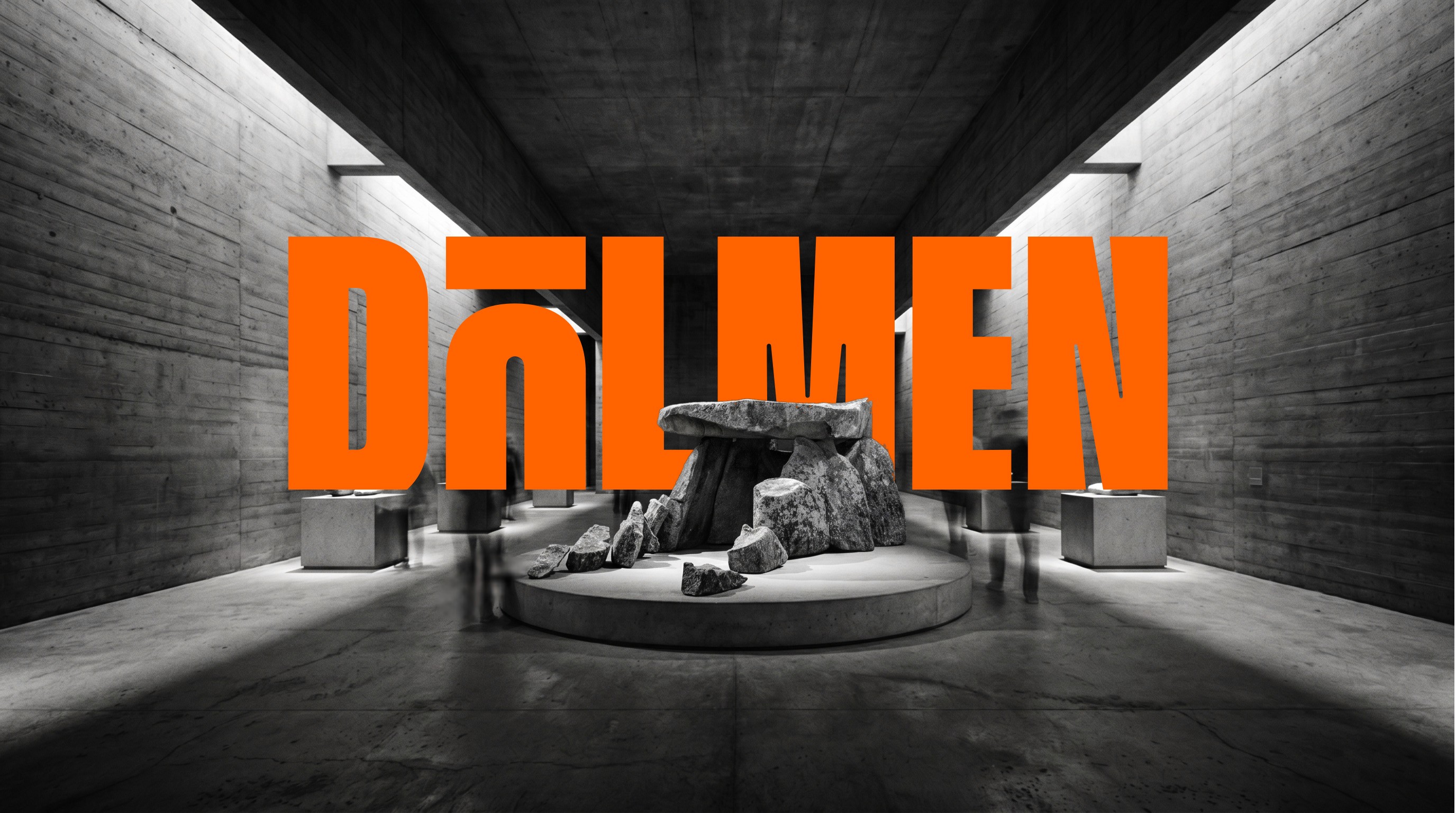 Interior of the DOLMEN exhibition center, with the dolmen centered and a bold orange logo of DOLMEN behind it