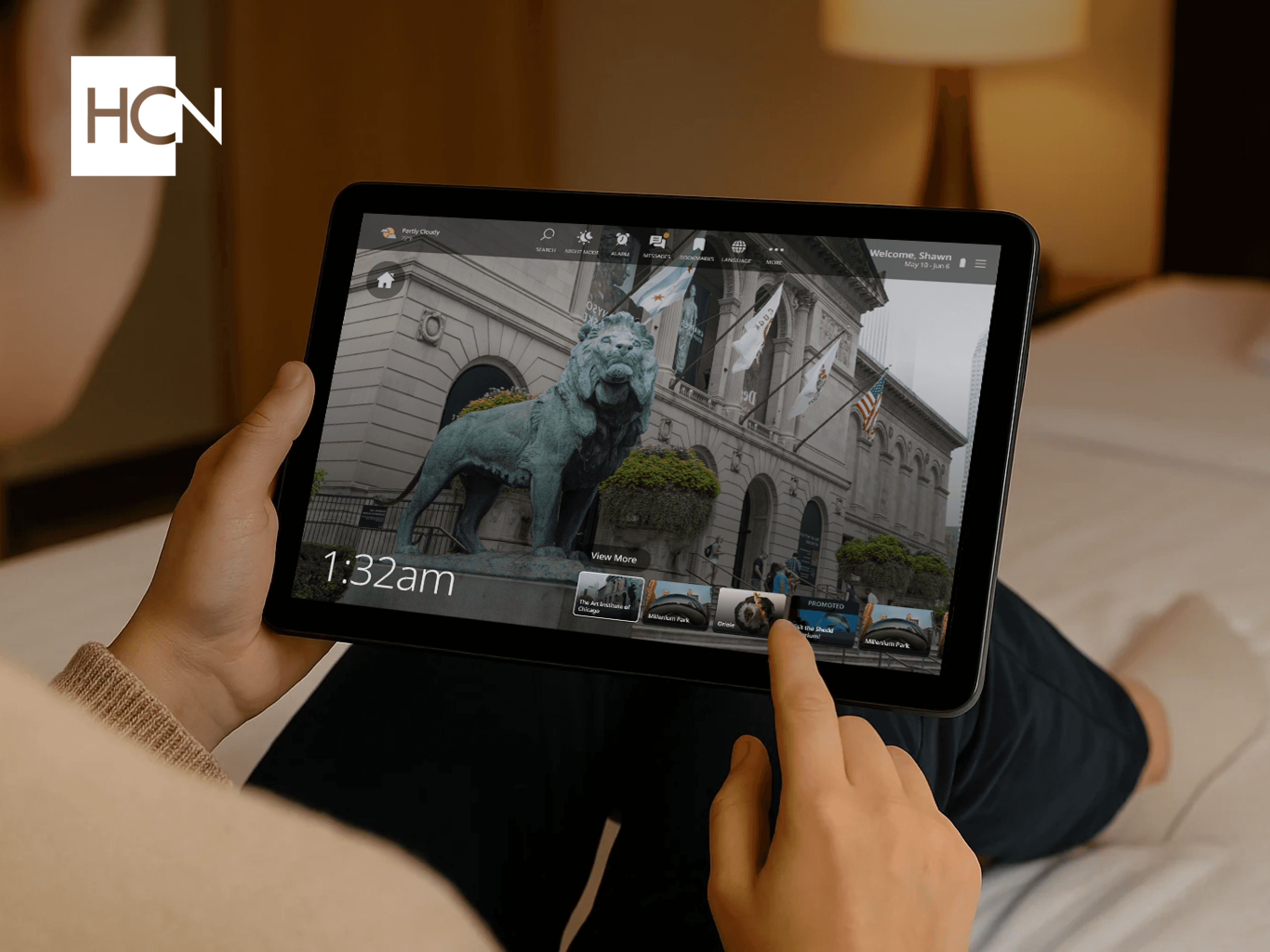 Person using the HCN Navigator tablet in a hotel room