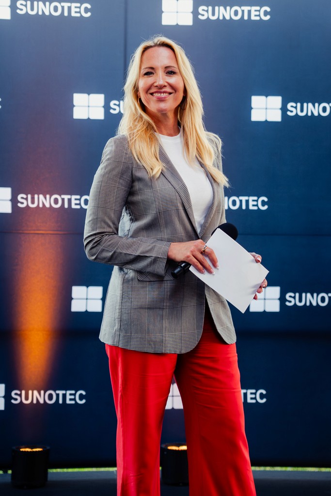 Female moderator speaking at an event