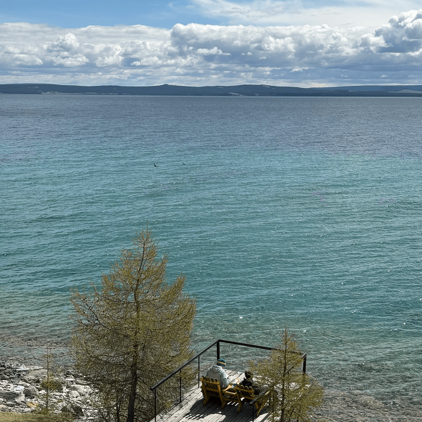 People relaxing by Khuvsgul lake
