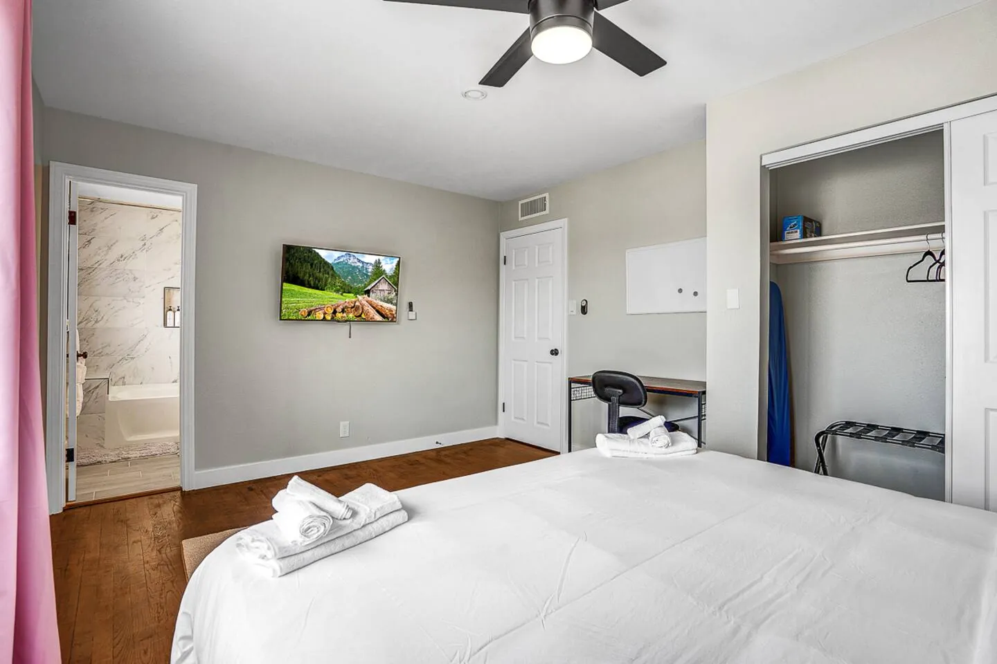 Upper-level king bedroom with a desk, Family Reunion Home in North Las Vegas