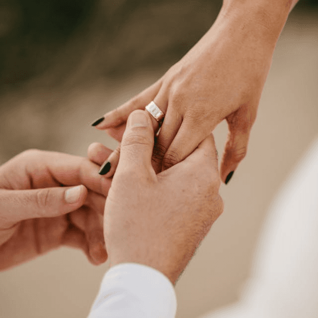 A couple holding hands together