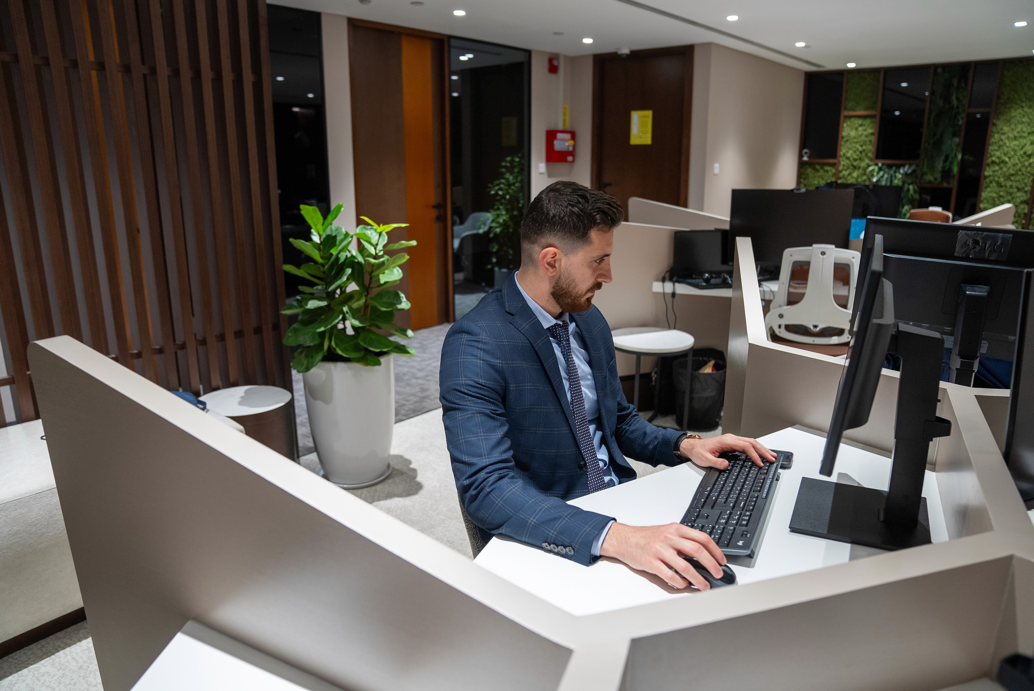 Business professional working in a modern Dubai office environment