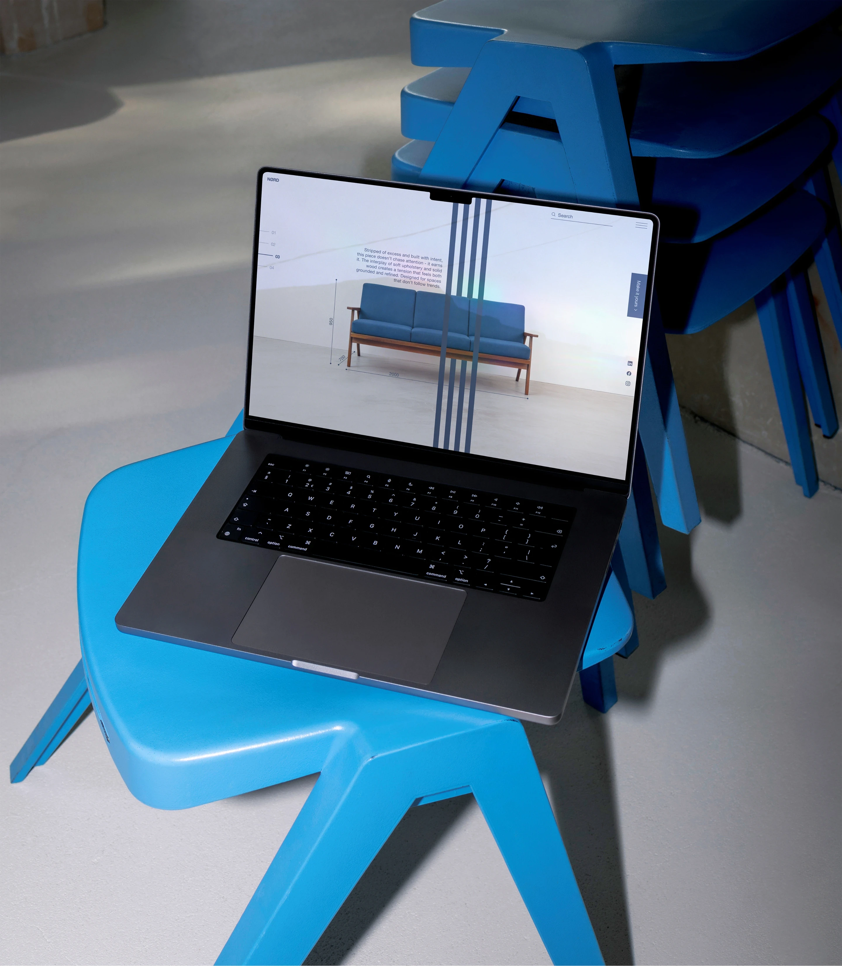 The website presented in a MacBook mockup.