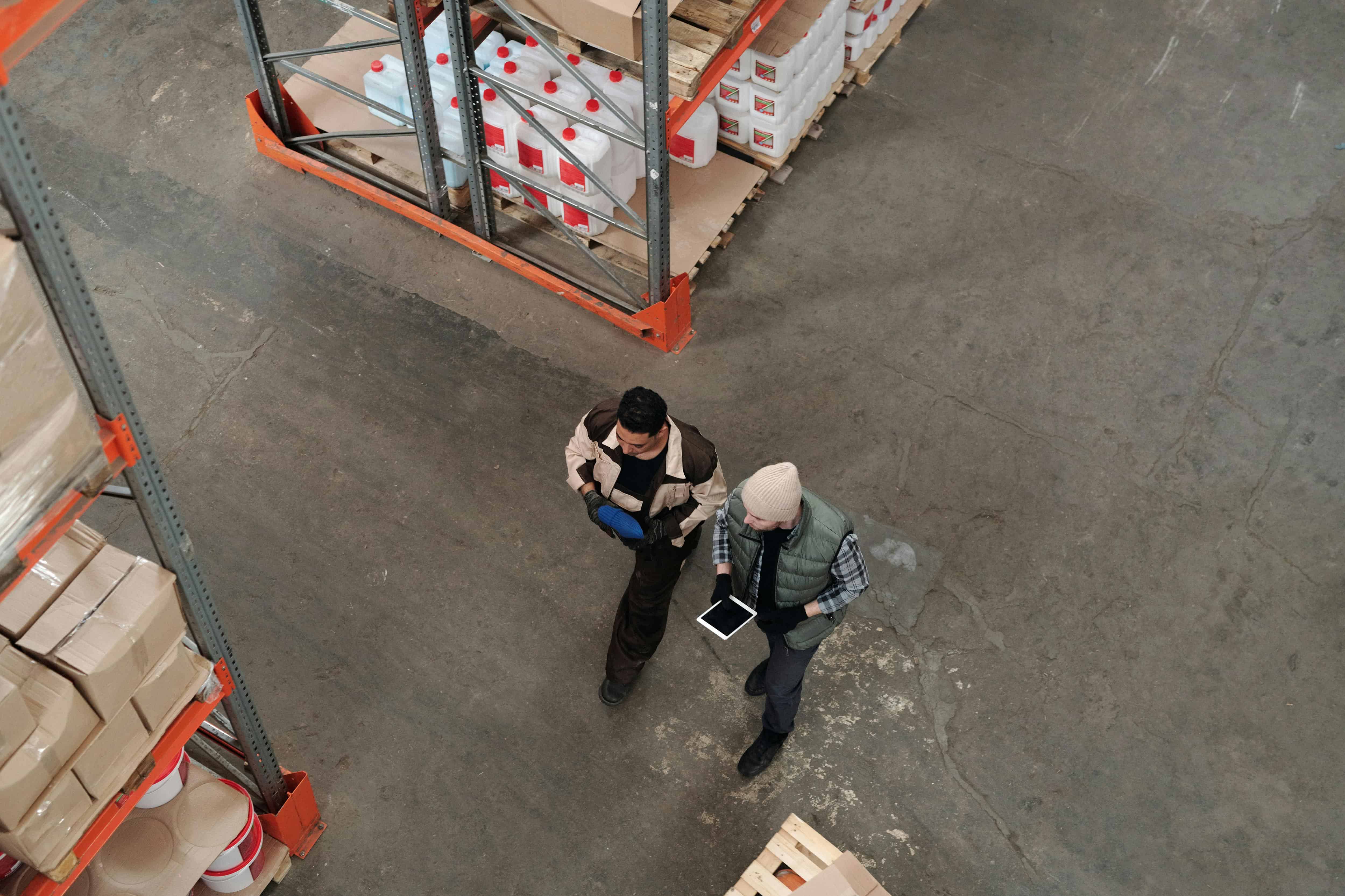Warehouse workers walking through a distribution facility