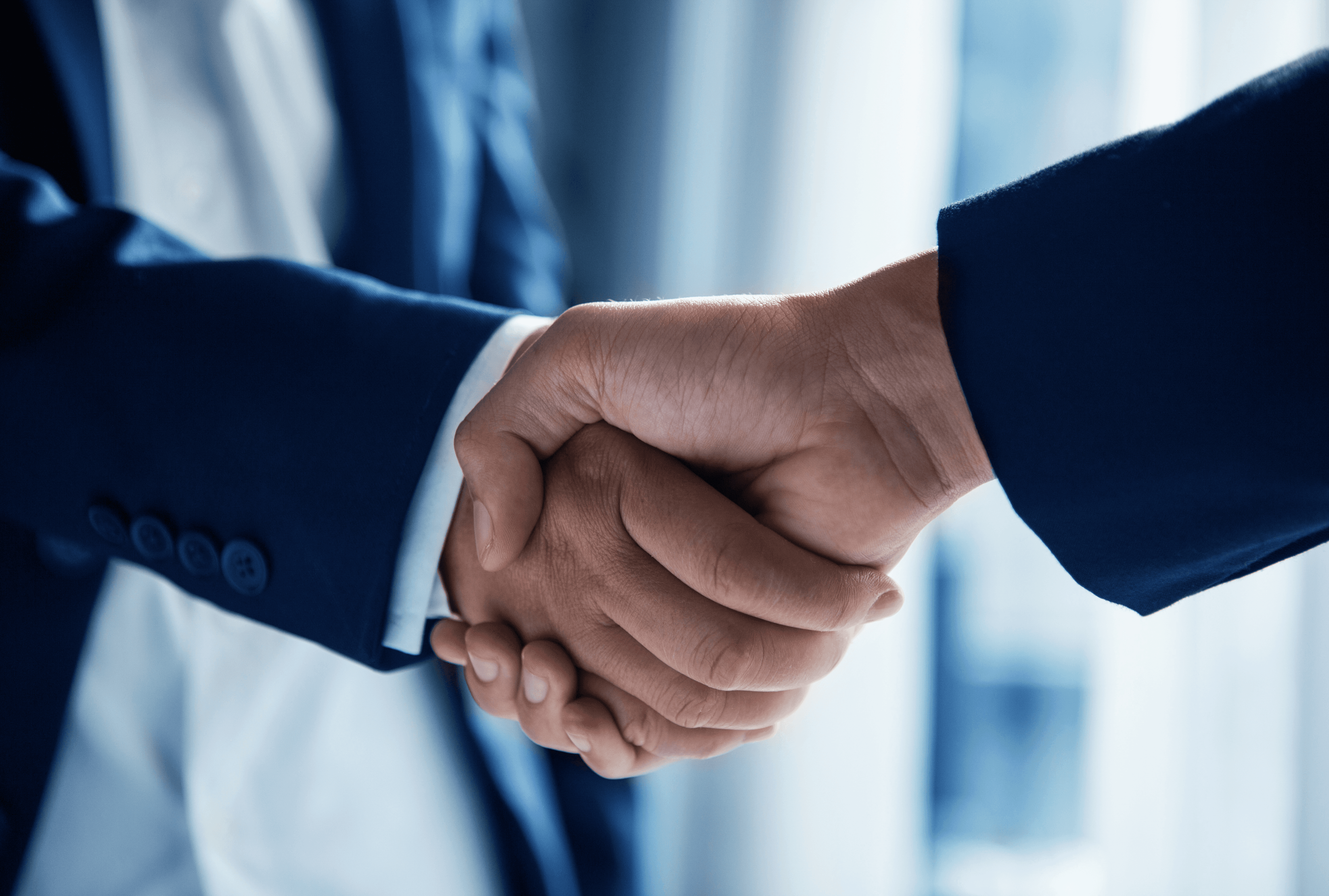 Creators handshaking