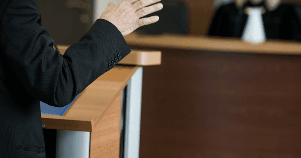 A lawyer speaking in court.