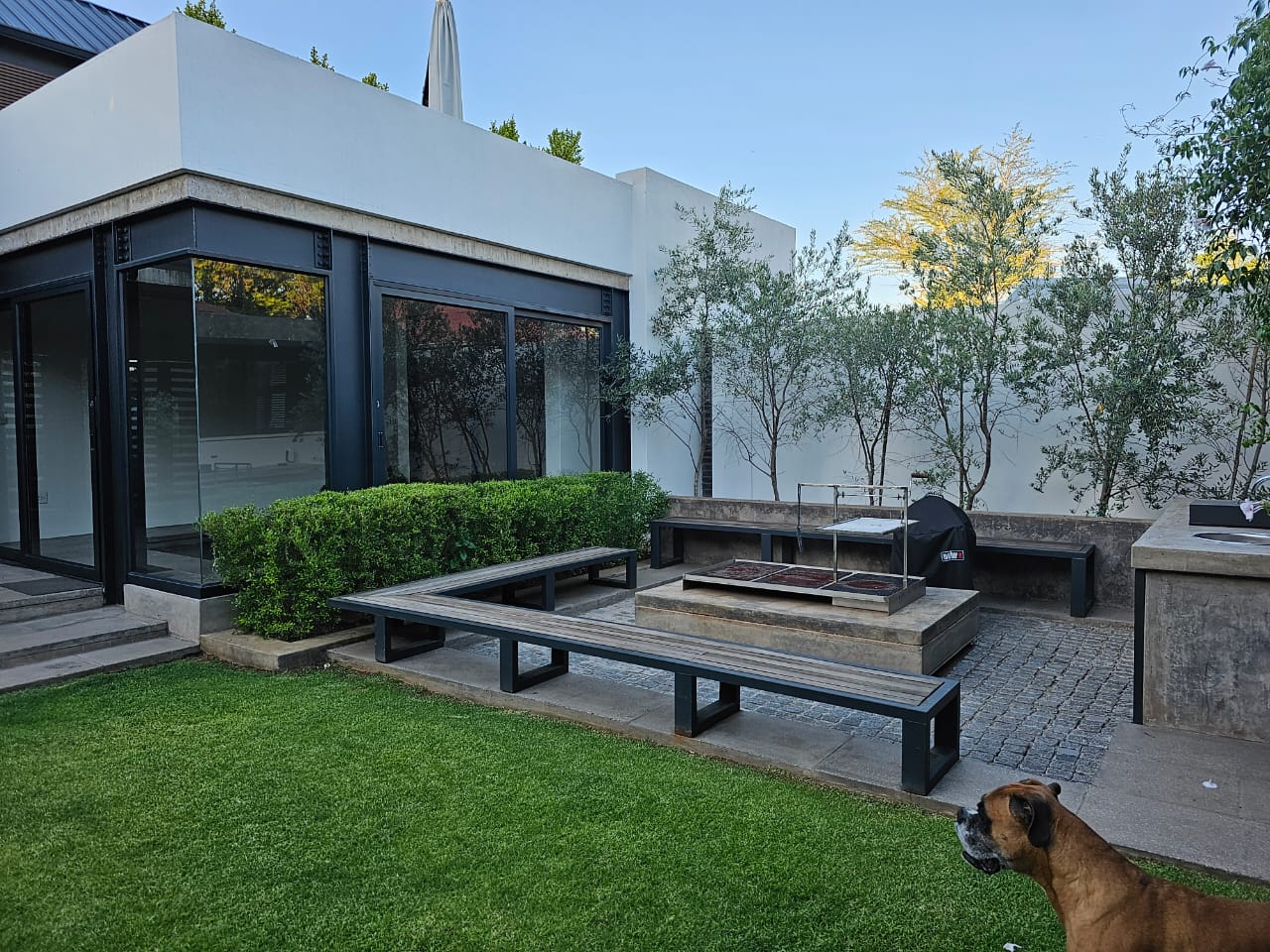 Close-up of futuristic white car front with sleek LED light design.