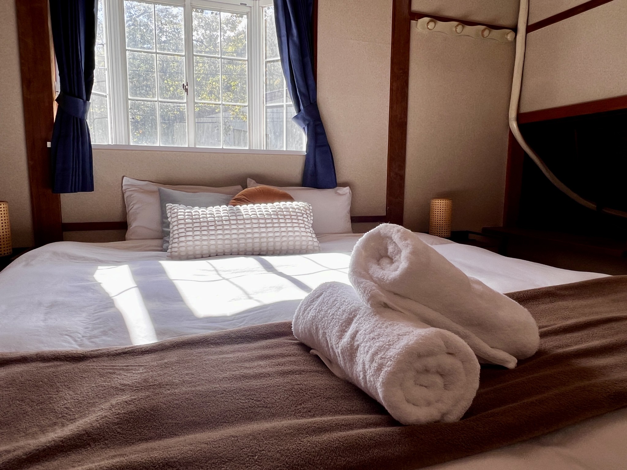 A cosy room with traditional Japanese design elements. The twin beds can be joined to create a spacious king bed. Ideal for couples or friends seeking a cultural experience.