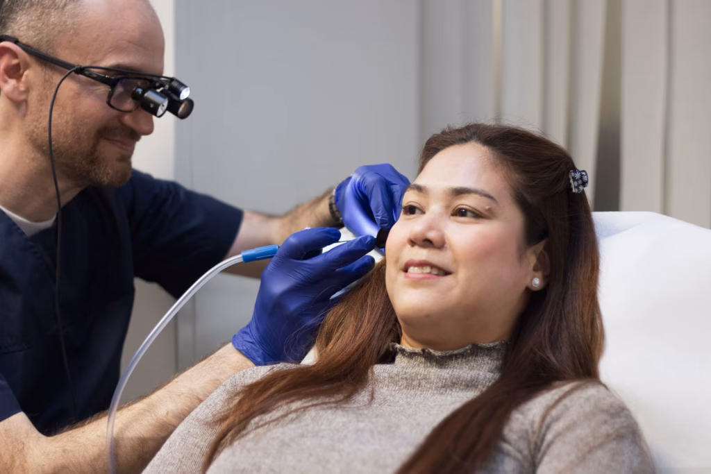 Professional microsuction ear wax removal treatment performed by John Beharrell