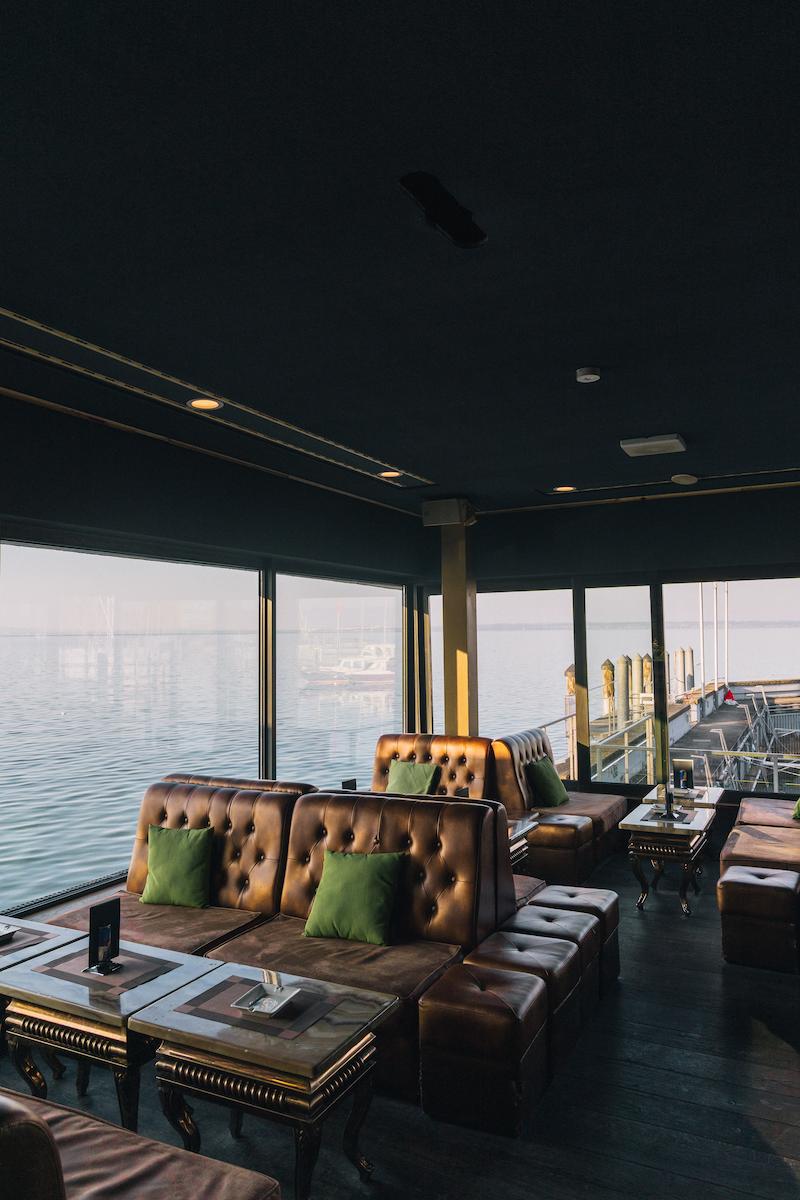 a restaurant with a view of the water