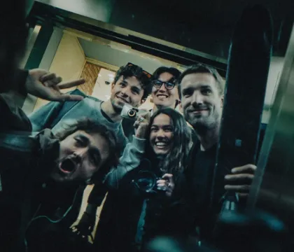 Reilin and Moos posing for a picture with a film crew