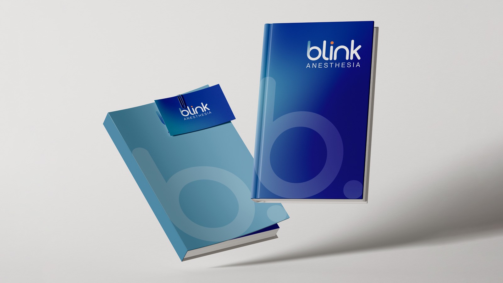 Close-up of a bed with orange and white striped bedding and floral-patterned pillows.