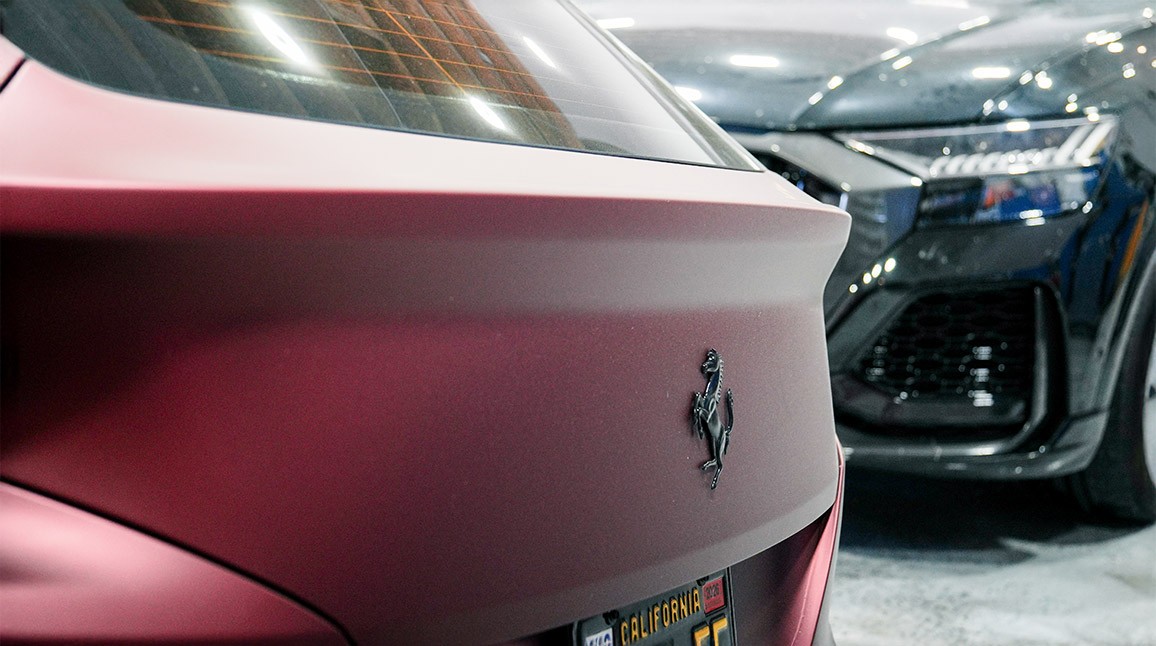 Multiple vehicles inside Auto Body Unlimited during collision repair and insurance-supported service.